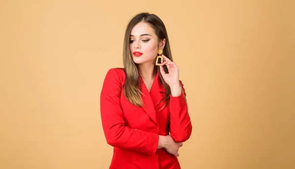 Sexy woman with professional makeup. beauty and fashion. hair beauty and hairdresser salon. jewelry earrings. Girl in red jacket. Fashion portrait of elegant woman. Long and healthy hair — Stock Photo, Image