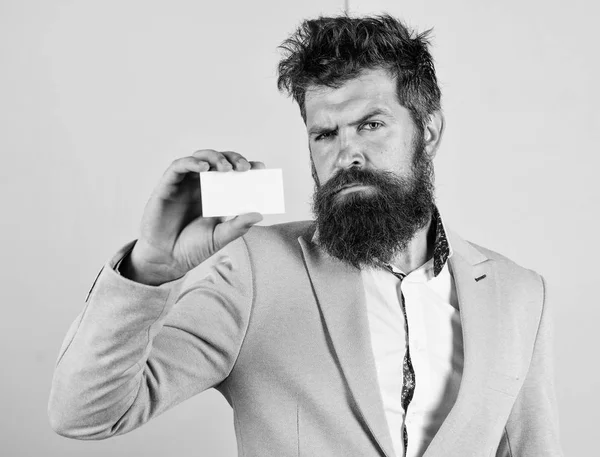 Feel free contact me. Businessman hold blank card. Bearded hipster serious face show card. Banking services for business. Business card design. Card copy space professional occupation position