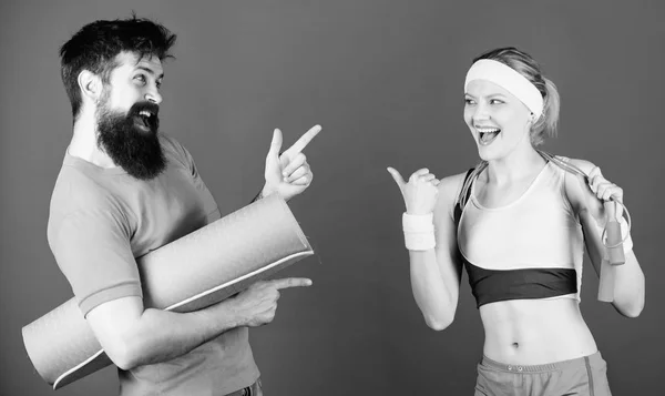 Lets do this. Athletic Success. Strong muscles and body. Sporty couple training with fitness mat and jump rope. Sport equipment. Happy woman and bearded man workout in gym. we will make it together