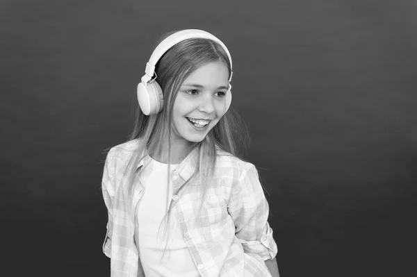 Online radio station channel. Girl child listen music modern headphones. Get music account subscription. Enjoy music concept. Music always with me. Leisure concept. Little girl listen song headphones
