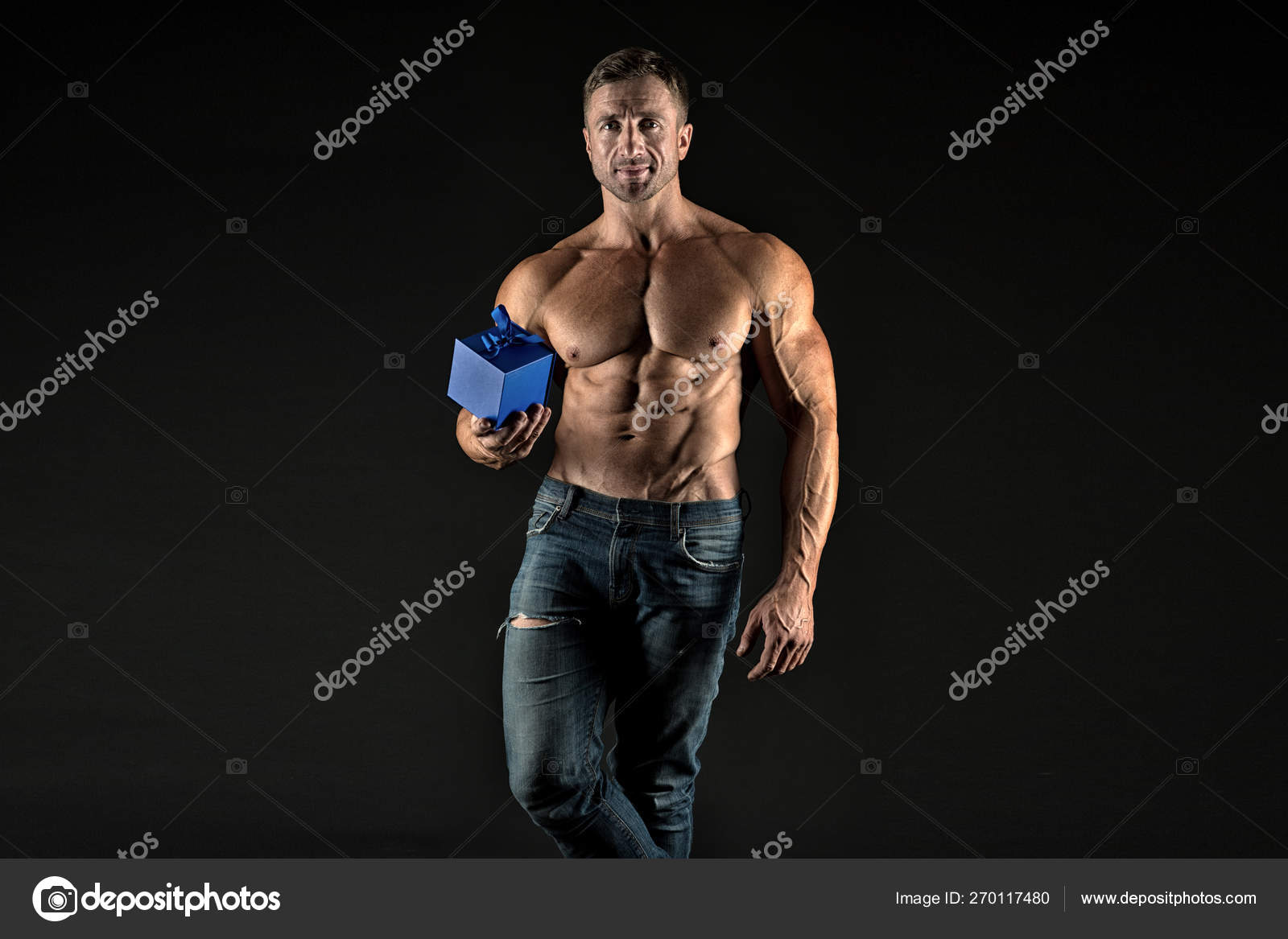 Something special. Macho muscular torso hold gift box. Sexy athletic macho  muscular chest. Athlete man has gift for you. Valentines day concept.  Bodybuilder holiday gift. Sportsman giving gift Stock Photo by ©stetsik
