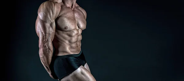Protein supplements. Muscles for actions. Torso six packs attractive black background. Muscular torso huge muscles result of exhausting trainings and proper nutrition. Muscular torso close up — Stock Photo, Image
