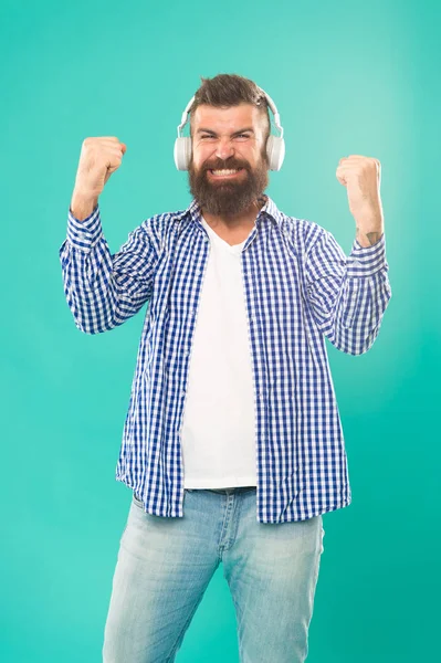 Man in headphones. Streaming music sites hippest and hottest around. Wireless technology. User friendly interface and large library of tunes. Hipster with beard listening music. Handsome music lover — Stock Photo, Image