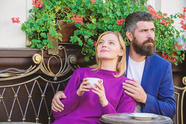 Time to relax. woman and man with beard relax in cafe. bearded hipster and girl drink coffee. First meet of girl and man. Couple in love on romantic date. Morning coffee relax. Best way to relax