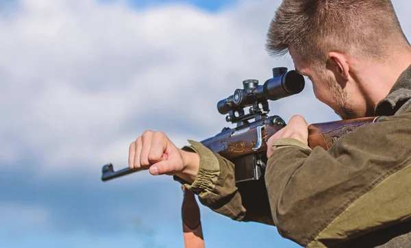 On my target. Bearded hunter spend leisure hunting. Hunting optics equipment for professionals. Brutal masculine hobby. Man aiming target nature background. Aiming skills. Hunter hold rifle aiming — Stock Photo, Image