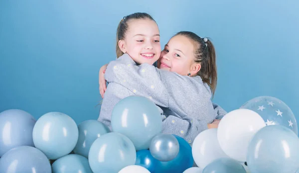 Balloon theme party. Girls best friends near air balloons. Birthday party. Happiness and cheerful moments. Carefree childhood. Start this party. Sisters organize home party. Having fun concept