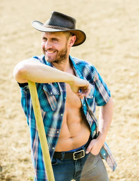 happy earth day. Eco living. farming and agriculture cultivation. Garden equipment. Eco farm. Harvest. muscular ranch man in cowboy hat. sexy farmer hold shovel. soils and fertilizers
