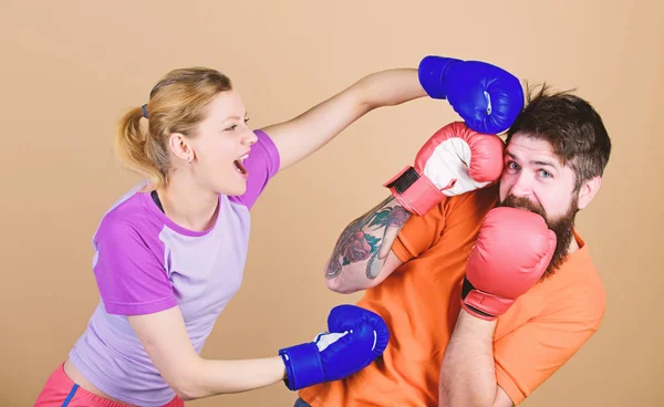 Punching, sport Success. knockout and energy. couple training in boxing gloves. training with coach. sportswear. Fight. Happy woman and bearded man workout in gym. Our sport is other sport punishment — Stock Photo, Image