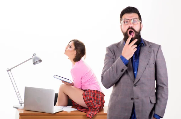 Training in business education. Blurred hipster with open mouth in foreground and pretty teacher in school for adult education. Sexy education worker and bearded man. Providing education and training — Stock Photo, Image