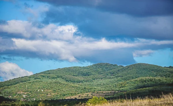 mountain landscape. blue sky with rainy clouds. sunny weather. travel and wanderlust. adventures are waiting for you. hiking camping trip. summer vacation. beauty of nature. adventure is out there