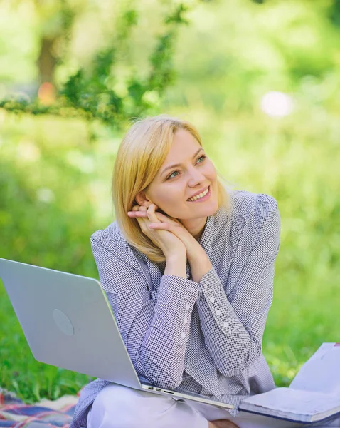 Woman with laptop sit on rug grass meadow. Online freelance career concept. Pleasant occupation. Guide starting freelance career. Business lady freelance work outdoors. Become successful freelancer