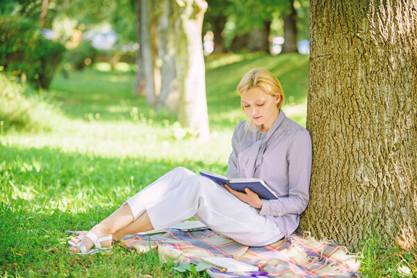 Books every girl should read. Relax leisure an hobby concept. Best self help books for women. Girl concentrated sit park lean tree trunk read book. Reading inspiring books. Bestseller top list