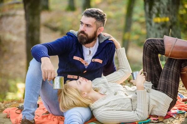 Picnic time. Happy loving couple relaxing in park together. Romantic picnic forest. Couple in love tourists relaxing on picnic blanket. Vacation weekend picnic camping and hiking. Tourism concept
