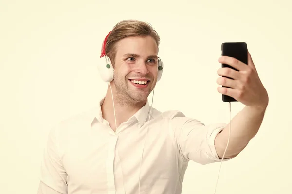 Im online. Music fan. Handsome man listen to music in headphones. Business man read business ebook online. Ebook holds much that is important to me — Stock Photo, Image