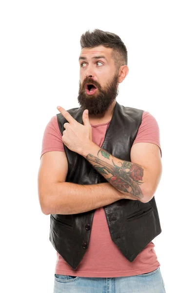 Guy pointing with index finger. Barbershop and beard grooming. Styling beard and moustache. Fashion trend beard grooming. Check this out. Hipster with beard brutal guy. Product recommendation concept