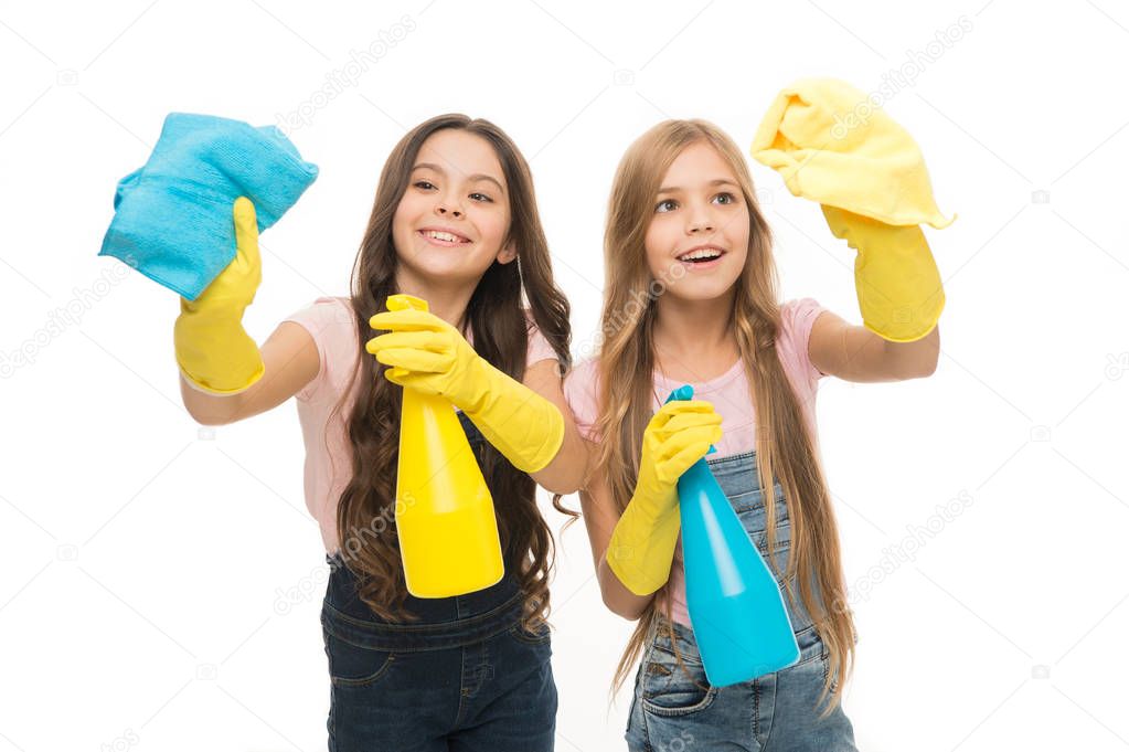 Protecting their home from dirt. Small housegirls dusting and cleaning home. Little home keepers holding spray bottles and wipers in rubber gloves. Services of home vacuuming and polishing