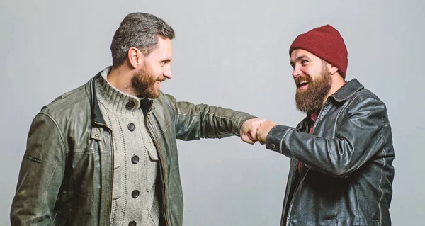 Real friendship mature friends. Male friendship concept. Brutal bearded men wear leather jackets. Real men and brotherhood. Friends glad see each other. Friendly relations. Friendship of brutal guys