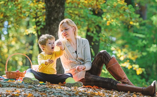 Spring mood. Happy family day. Sunny weather. Healthy food. Mother love her small child. Family picnic. Mothers day. Happy son with mother relax in autumn forest. picnic relax. leisure time on picnic