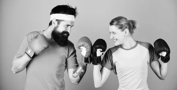 knockout and energy. couple training in boxing gloves. train with coach. sportswear. punching, sport Success. Happy woman and bearded man workout in gym. No one is failure until they stop trying