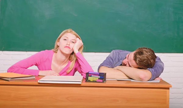 School stuff. Student life. Lesson and blackboard. Teachers day. Modern school. Knowledge day. Couple of man and woman in classroom. Home schooling. Back to school. tired couple — Stock Photo, Image