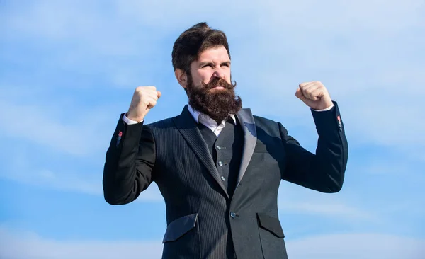 Success and luck. Man bearded optimistic businessman wear formal suit sky background. Optimistic mood. Think like optimist. Being optimistic. Celebrate success. Hopeful and confident about future