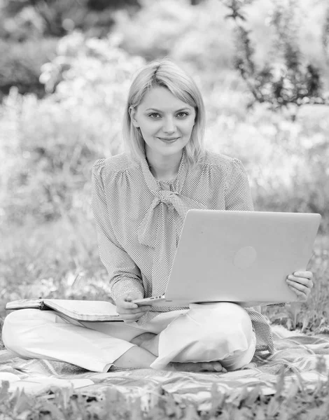 Business lady freelance work outdoors. Become successful freelancer. Woman with laptop sit on rug grass meadow. Online freelance career concept. Guide starting freelance career. Pleasant occupation