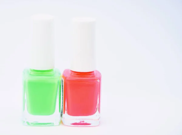 Nail polish bottles. Beauty and care concept. Nail polish white background. Durability and quality polish coating. Gel polish modern technology. How to combine colors. Manicure salon. Fashion trend