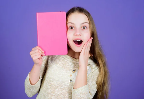 Reading skill. Personal diary. Textbook presentation. Study and learn. Girl hold book violet background. Kid show book. Book concept. Wise quotes. Literature club. Development and education — Stock Photo, Image