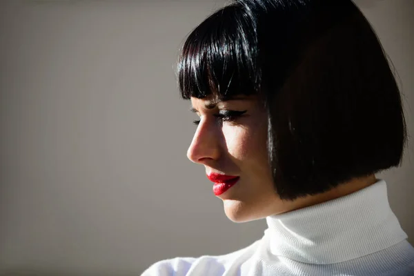 Fashion and beauty concept. Makeup bright accent on lips. Red lipstick makeup suits her. Perfect makeup for brunette lady. Woman mysterious with red lips makeup face defocused background close up