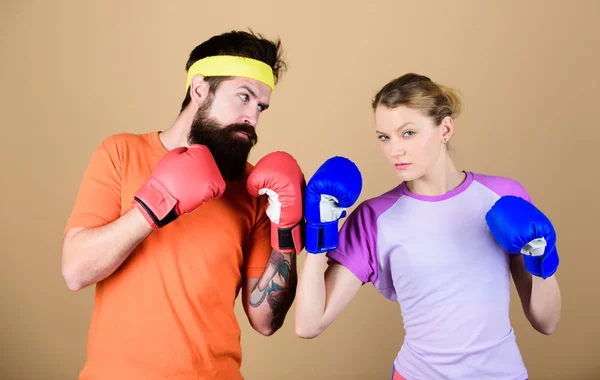 Be careful. Boxing sport concept. Couple girl and hipster practicing boxing. Sport for everyone. Amateur boxing club. Equal possibilities. Strength and power. Man and woman in boxing gloves