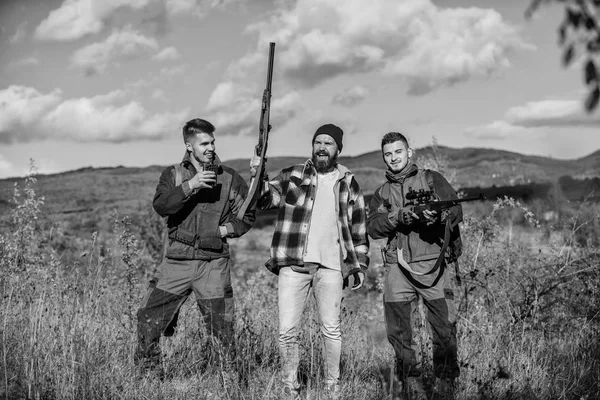Activity for real men concept. Hunters gamekeepers looking for animal or bird. Hunters with rifles in nature environment. Illegal hunting. Hunters friends enjoy leisure. Poacher partner in crime — Stok fotoğraf