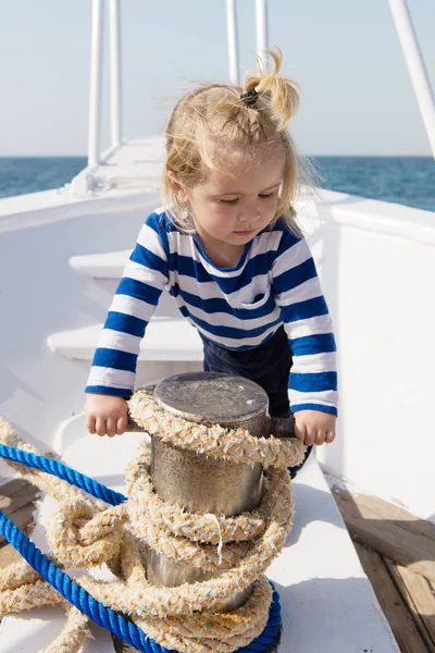 Child sailor. Boy sailor travelling sea. Boy sailor striped shirt sea yacht travel around world. Little sea traveller. Beach is calling and we must go. Baby boy enjoy vacation sea cruise ship