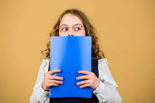 Preparing to exams in library. Small child formal wear. Prepare for exam. Formal education and homeschooling. Check knowledge. School exam concept. Final exam coming. Girl hold textbook folder test — Stock Photo, Image