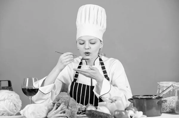 Gourmet main dish recipes. Delicious recipe concept. Girl in hat and apron. Cooking healthy food. Fresh vegetables ingredients for cooking meal. Lets start cooking. Woman chef cooking healthy food
