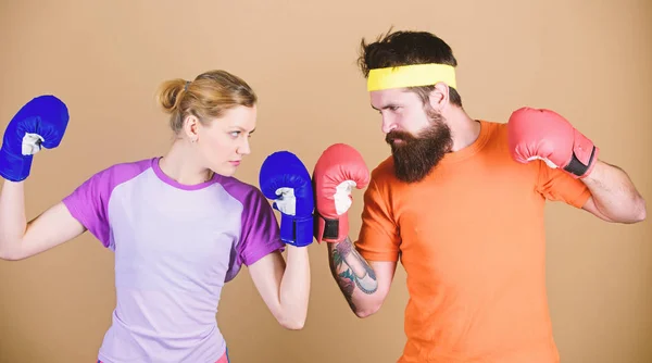 Couple girl and hipster practicing boxing. Sport for everyone. Amateur boxing club. Equal possibilities. Strength and power. Man and woman in boxing gloves. Family battle. Boxing sport concept