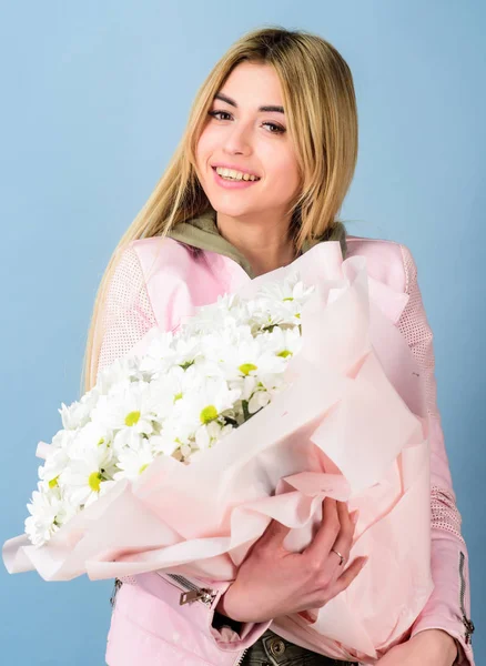 Chamomile flower symbol of innocence and tenderness. Celebrating her special day. Adore flowers. Surprise for girlfriend. Girl tender sensual blonde hold flowers bouquet. Flowers delivery service