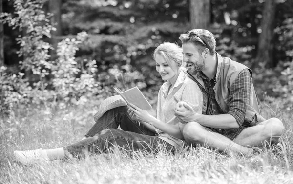 Romantic date at green meadow. Couple in love spend leisure reading book. Romantic couple students enjoy leisure with poetry nature background. Couple soulmates at romantic date. Pleasant weekend — Stock Photo, Image