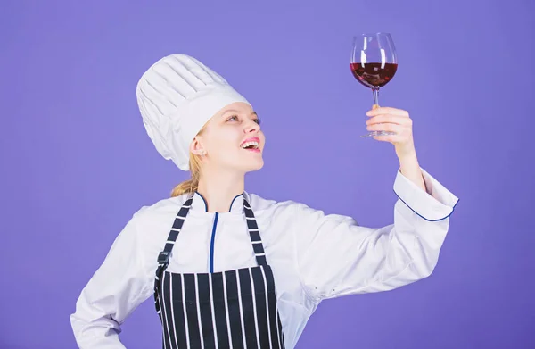 Which wine serve with dinner. Sommelier enjoy wine. Excellent taste. Sommelier skills. Serving wine at restaurant. Woman chef hold glass of wine. Outstanding toasts that work for any occasion