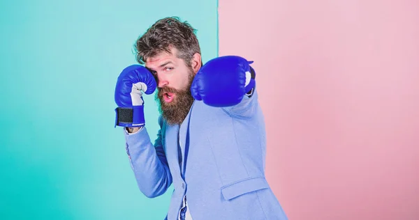 Committed to success. Bearded man in boxing stance. Businessman in formal wear and boxing gloves. Sport improves his leadership skills. Fighting for success in sport and business. Strong and powerful