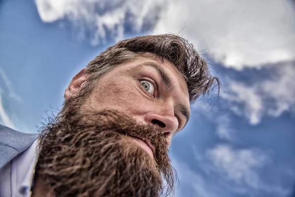 Check out my long beard. Ultimate moustache grooming guide. Hipster handsome bearded attractive guy bottom view. Expert tips for growing moustache. Man bearded hipster with mustache sky background
