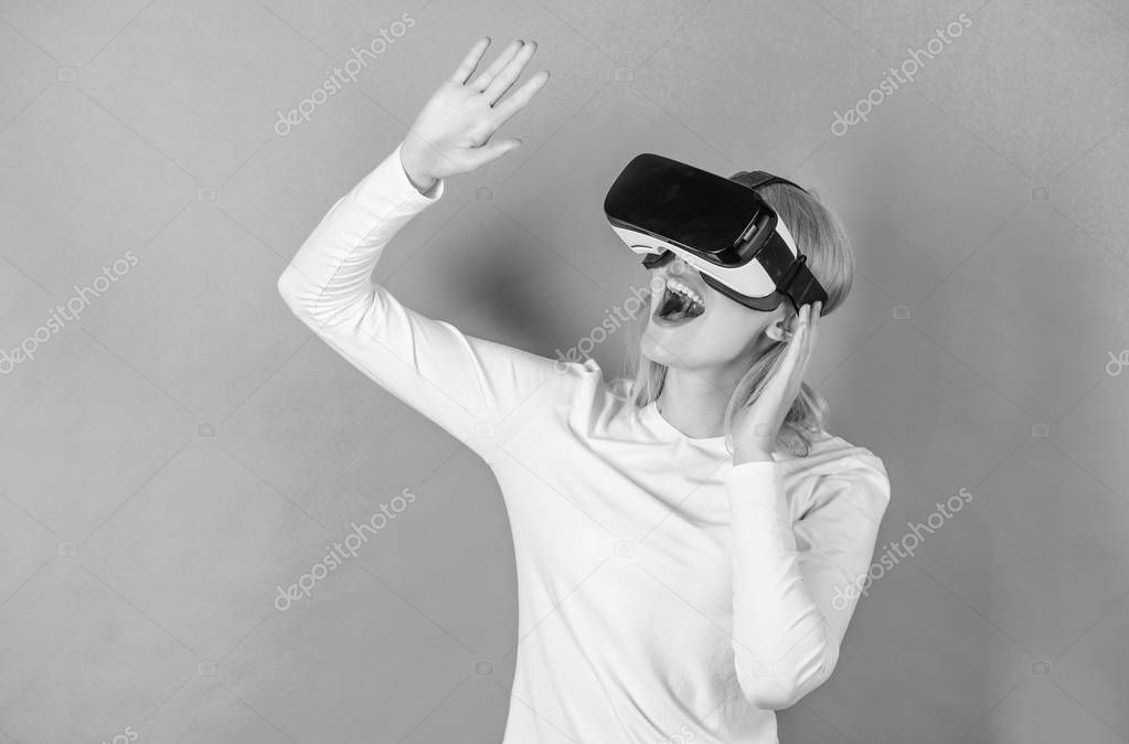 Woman using VR device. A person in virtual glasses flies in room space. Woman excited using 3d goggles. Augmented reality, technology, business and people concept -businessman in virtual glasses.