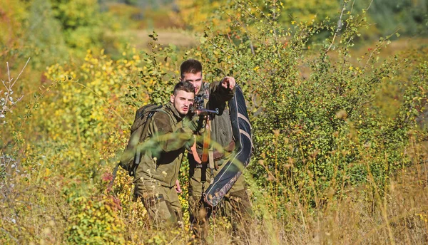 Army forces. Camouflage. Military uniform fashion. Hunting skills and weapon equipment. How turn hunting into hobby. Man hunters with rifle gun. Boot camp. Friendship of men hunters. poacher..