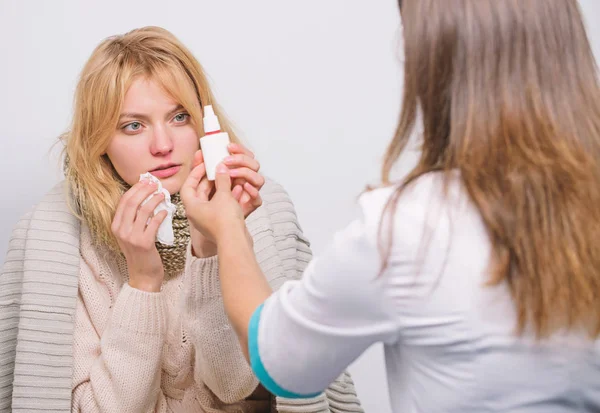 It can help clear her sinuses. Medical doctor examining patient. Primary care doctor making diagnosis to sick woman. Doctor visiting unhealthy woman at home. Patient care and healthcare — Stock Photo, Image