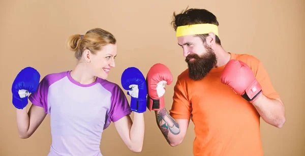 knockout and energy. couple training in boxing gloves. train with coach. sportswear. punching, sport Success. Happy woman and bearded man workout in gym. No one is failure until they stop trying