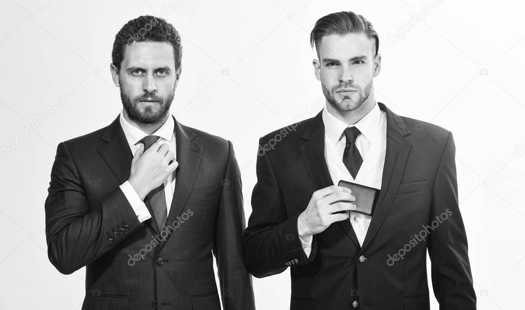 Men adjusting business suits. Confident in their style. Business people choose formal clothing. Every detail matters. Stylish appearance. Business style dress code. Get ready business conference