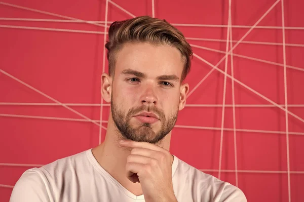 Use right product styling hair. Confident with tidy hairstyle. Barber hairstyle tips. Man bearded guy modern hairstyle in pensive mood pink background. Simple hacks to make hairstyle better