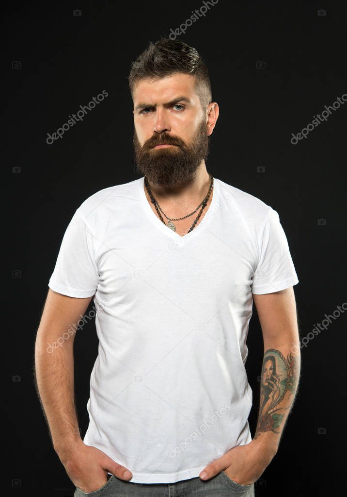 Bearded confident hipster. Beard fashion and barber concept. Man handsome hipster stylish beard and mustache. Barber tips maintain beard. Styling and trimming beard care. Beauty and masculinity