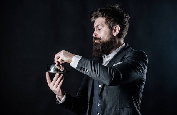 Best chef ever. Mature hipster with beard hold food tray in restaurant. brutal caucasian hipster hold metallic dish. businessman in suit. Waiter man. Perfect recipe. Bearded man chef presenting meal