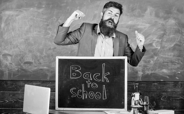 Full of energy after summer school holidays. Teacher educator welcomes new enrollees to begin study and get education. Welcome back to school. Teacher or educator welcomes inscription back to school — Stock Photo, Image