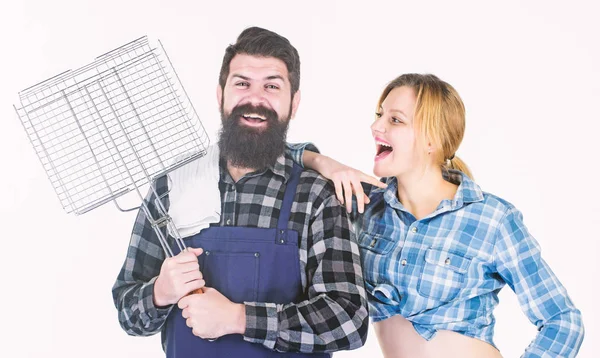 Bearded hipster and cheerful girl hold cooking grilling utensils white background. Essential barbecue dishes. Make it tasty. Picnic and barbecue. Family barbecue concept. Barbecuing common technique — Stock Photo, Image